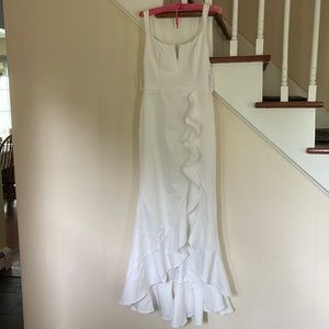 Selling a Ruffle High Low Skirt Dress in soft white, size 6, never worn w tag.